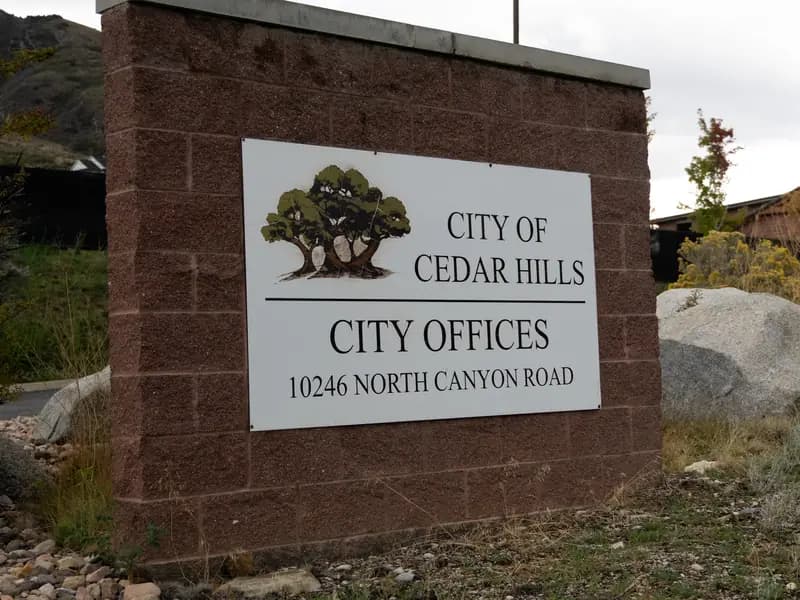 Cedar Hills city offices sign with the foothills behind