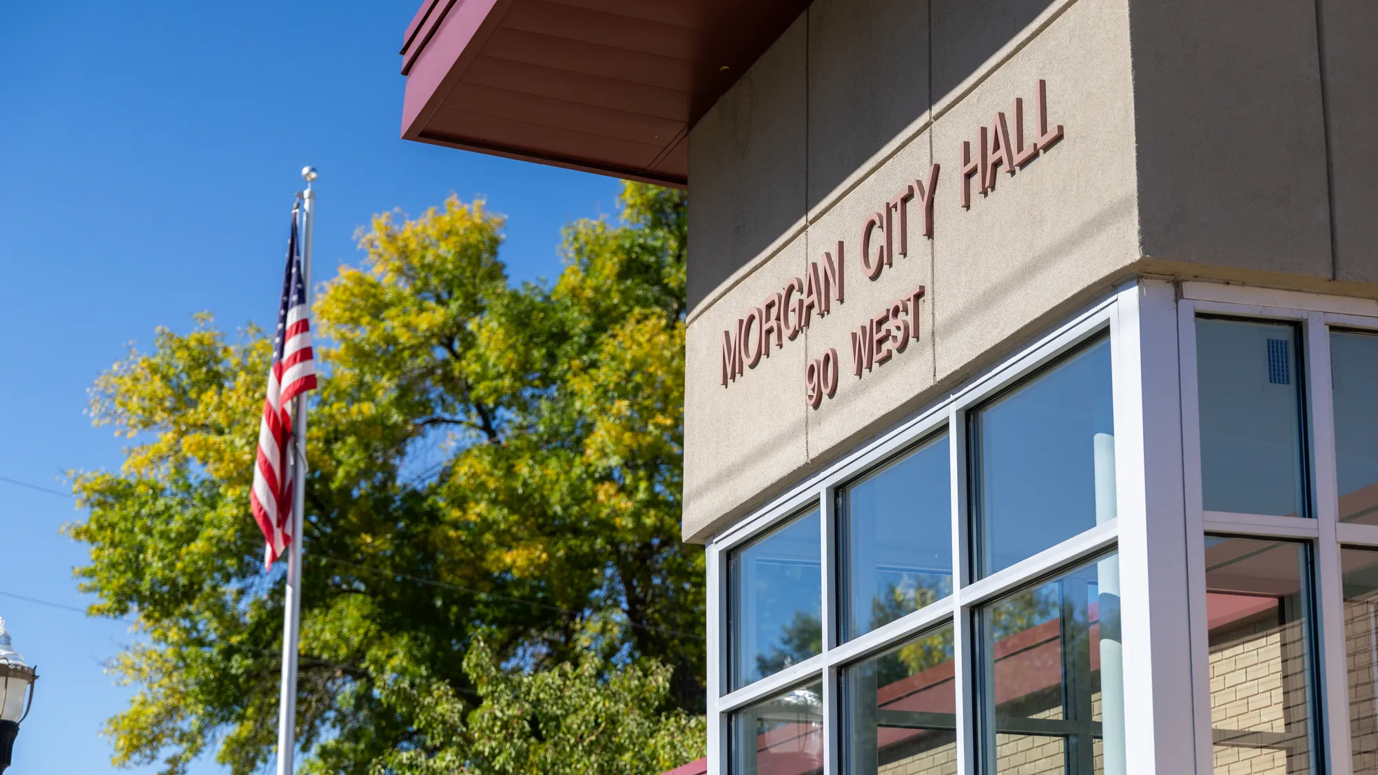 Morgan City Hall at 90 West with the flag